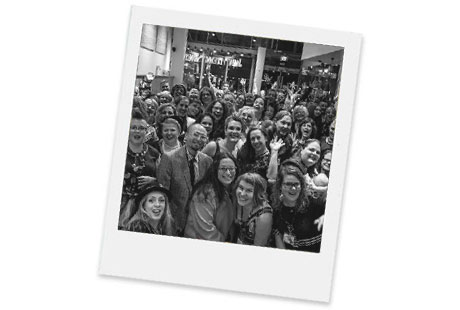 Polaroid image of dozens of Fluevogers posing for a picture during Flummunity Fest 2019 in Portland.